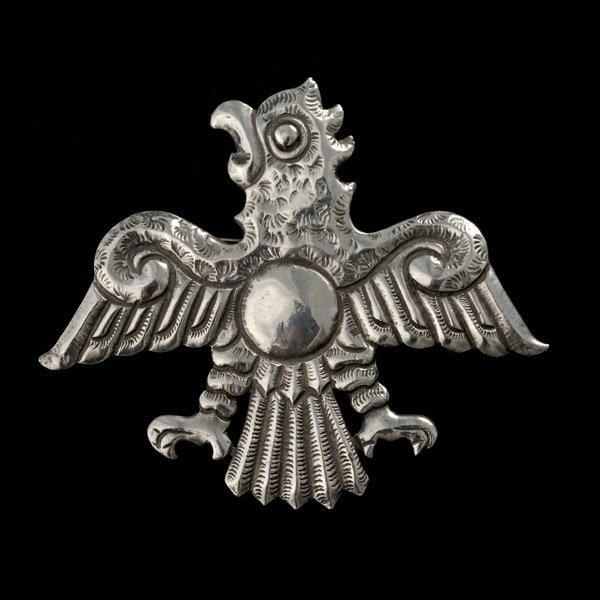 COLLECTION OF TWO SILVER BROOCHES.: COLLECTION OF TWO SILVER BROOCHES. Including a donkey brooch stamped 'Mexico, Silver'; together with a silver eagle brooch. 26.3 dwts.