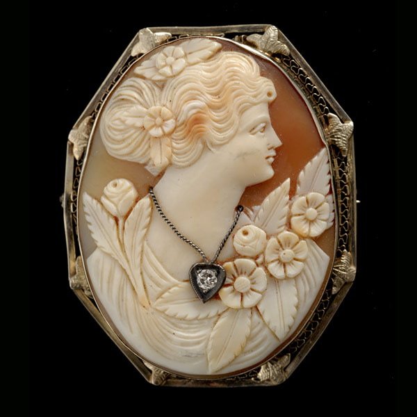 SHELL CAMEO, DIAMOND, 14K WHITE GOLD PENDANT BROOC: SHELL CAMEO, DIAMOND, 14K WHITE GOLD PENDANT BROOCH. Featuring one shell cameo measuring approximately 43.00mm x 33.00mm, depicting the profile of a lady, accented by a diamond necklace weighing appro