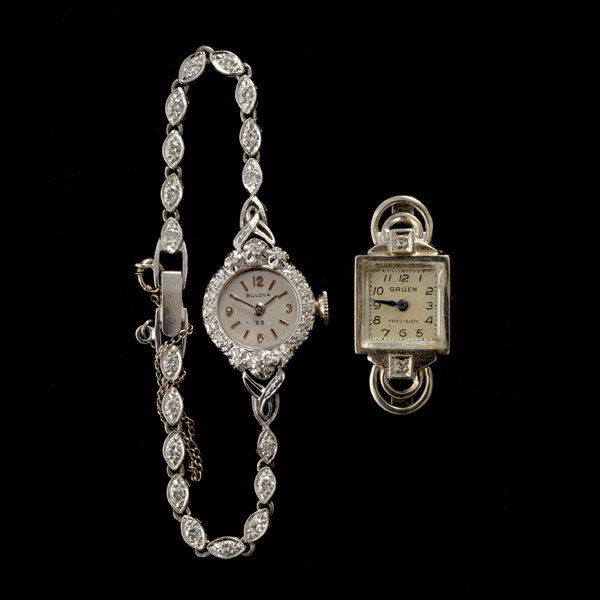 TWO DIAMOND, 14K WHITE GOLD WRISTWATCHES.: COLLECTION OF TWO DIAMOND, 14K WHITE GOLD WRISTWATCHES. Including one ladies diamond, 14k white gold Bulova wristwatch; together with a diamond, 14k white gold Gruen wristwatch; total diamond weight i