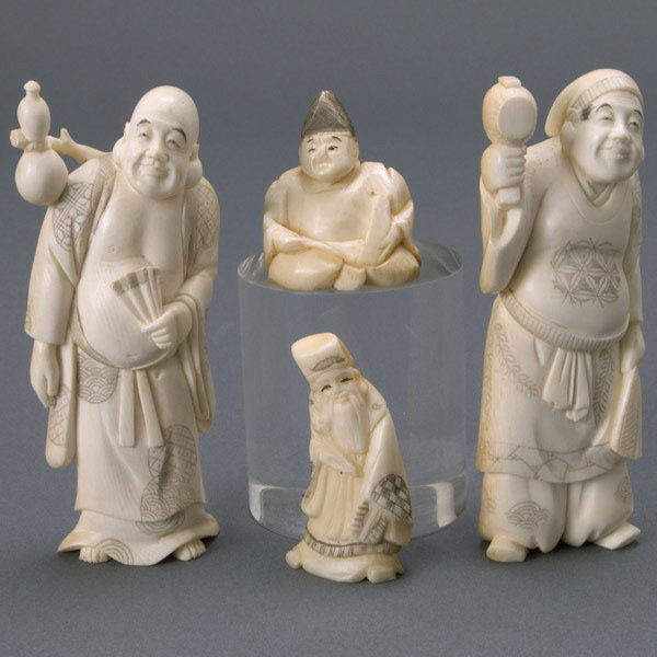 Four Japanese Carved Ivory Figures, 20th Century: Four Japanese Carved Ivory Figures, Signed, 20th Century. First holds a folding fan and double gourd; second holds a wooden tool and leaf fan; third sits with triangular hat and scroll in hand; fourth