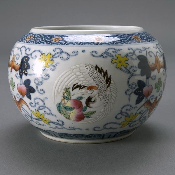 Small Wucai Decorated Porcelain Jar, Xuantong Mar: A Small Wucai Decorated Porcelain Jar, Xuantong Mark, short swollen body decorated with bats, peaches and floral scrolls surrounding medallions of cranes and peaches, wave bands at rim and foot, the s
