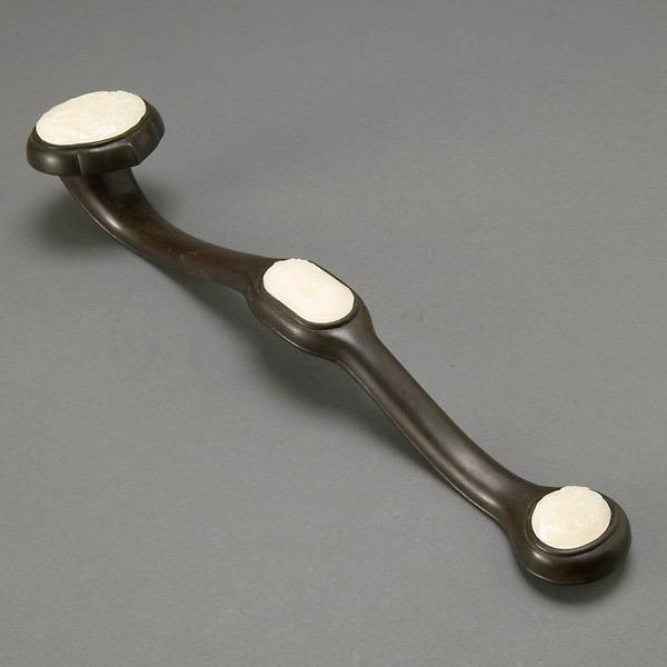 A Zitan Ruyi Scepter Inset with Jade Plaques: A Zitan Ruyi Scepter Inset with Jade Plaques, carved in relief with various birds, trees and flowers {Length 19 1/2 inches}