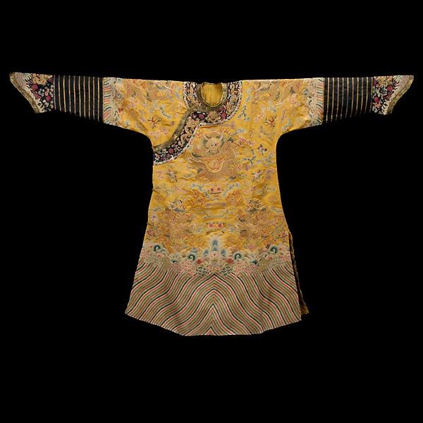 A Yellow-Ground Silk Robe Embroidered with Dragon: A Yellow-Ground Silk Robe Embroidered with Dragons, groups of ornately designed gilt dragons decorate the front, back and sleeves, bold diagonal striping to hem {Height 56 1/2 inches}