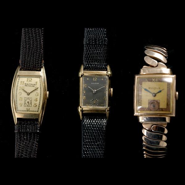 THREE GOLD-FILLED, METAL WRISTWATCHES.: COLLECTION OF THREE GOLD-FILLED, METAL WRISTWATCHES. Including one Waltham mechanical, 10k gold-filled, brown leather wristwatch; one Bulova mechanical, 10k gold-filled, brown leather wristwatch; toge