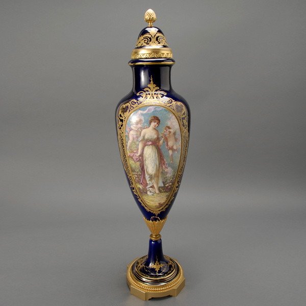 Sevres Style Bronze Mounted Porcelain Covered Urn: Sevres Style Gilt Bronze Porcelain Urn The ovoid body finely painted with an oval medallion featuring Venus as a maiden with two amorini consorts in a garden, the reverse with a impressionistic landsc