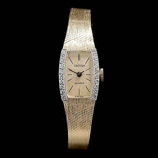 LADIES CROTON DIAMOND, 14K YELLOW GOLD WRISTWATCH.: LADIES CROTON DIAMOND, 14K YELLOW GOLD WRISTWATCH. Dial: Tonneau, gold tone, black bar hour markers, black baton hands, quartz, Croton. Movement: Quartz, 6 Jewels, unadjusted, Croton time. Case: Recta