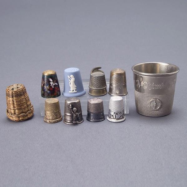 Nine Assorted Thimbles (mostly silver);: Nine Assorted Thimbles (mostly silver); including a Wedgwood and an enamel example; together with a thimble form shot cup (10) {Height of cup 1 1/2 inches}
