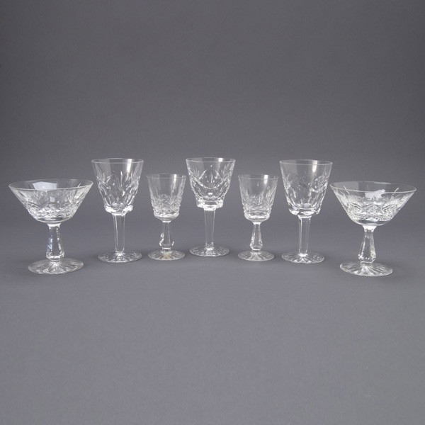 Suite of Waterford Stemwares: 32: Suite of Waterford Stemwares: six champagne coupes (height 4 5/8 inches, two with rim chip); sixteen wine glasses (height 5 3/4 inches, two with rim chips, one with tiny nick in rim); and ten cordials