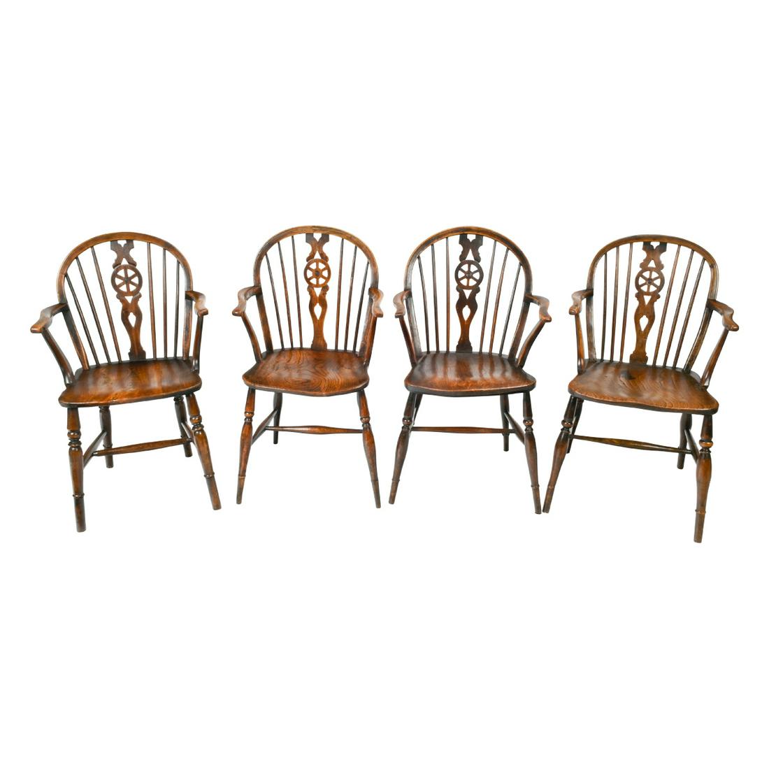Harlequin Set of Eight Elm Windsor Wheel-Back Chairs.: 19th Century Harlequin Set of Eight Elm Windsor Wheel-Back Chairs. Wheel backs, curved arms, shaped seats, turned legs and stretchers. All chairs are very similar in design with slight variations in s