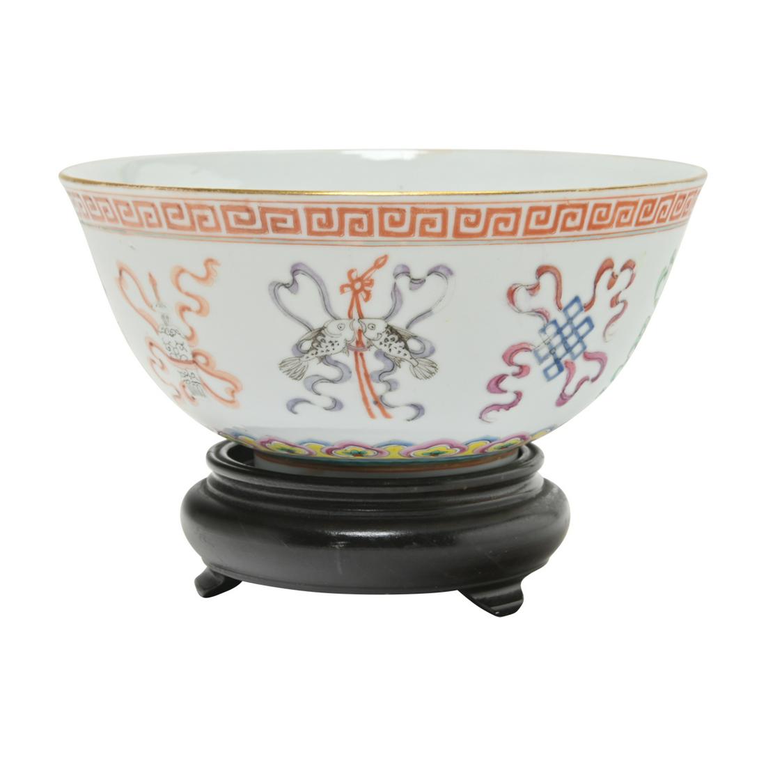 A Chinese Famille Rose 'Bajixian' Bowl: A Chinese Famille Rose 'Bajixian' Bowl, Guangxu mark. The everted sides enameled with Buddhist eight treasure symbols 'Bajixian' between the red key-fret border on the rim and a band of ruyi heads abo