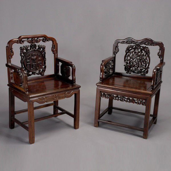 Two Hardwood Arm Chairs: Two Hardwood Arm Chairs, both with circular openwork backsplats; the first depicting a deer and bird among lotus blossoms surrounded by bats, an openwork double-gourd apron; the second with a 'bogu' t