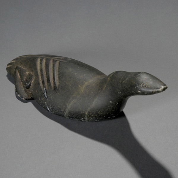 Inuit Soapstone Figure of Arctic Bird: INUIT Soapstone Figure of Arctic Bird, illegibly signed [Chip to tail] L = 13 1/2 inches.