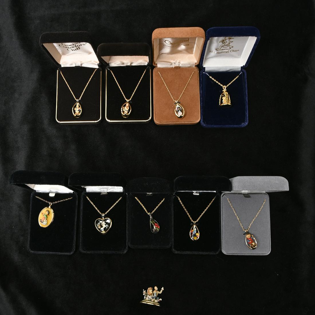 13 Olszewski Enamel Miniature Necklaces / Pendants.: 13 Olszewski Enamel Miniature Necklaces / Pendants. All of painted enamel, some on sterling silver, with 18kt gold plated details and chains. Made for Hummel Club, Gobel Franklin Mint, and The Danbury