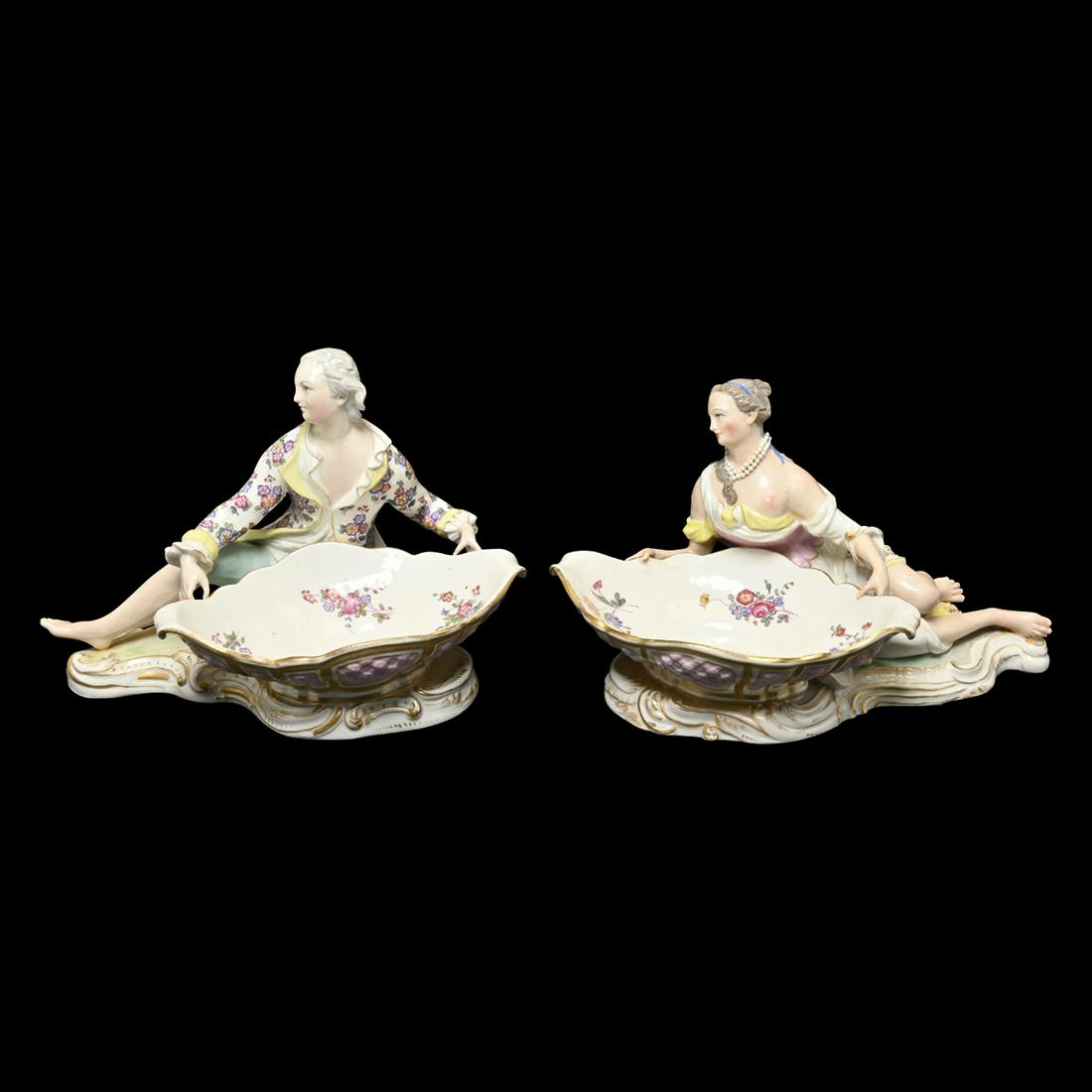 Pair of Meissen Marcolini Figural Sweetmeat Baskets.: Pair of Meissen Marcolini Porcelain Figural Sweetmeat Baskets. Male and female figures, the figures reclining by a basin, parcel gilt and floral painted decoration throughout. Male figure marked with 