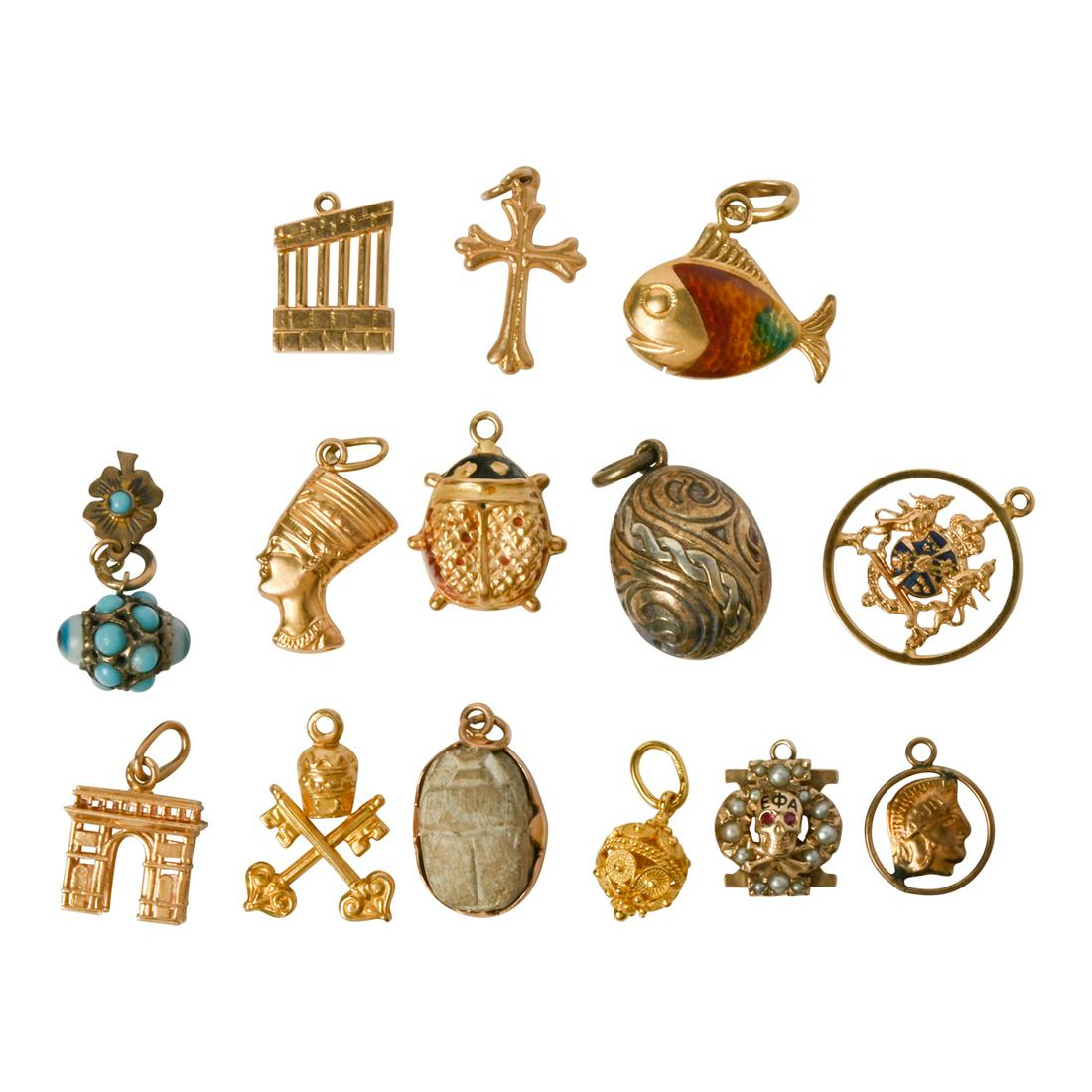 Collection of Fourteen Loose Charms.: Collection of Fourteen Loose Charms. Including one enamel, 18k yellow gold lady bug; one 14k yellow gold Egyptian pharaoh head; one 14k yellow gold Roman circle head; one 14k yellow gold cross; one 14