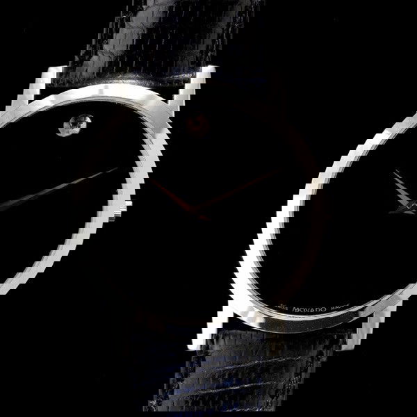 GENTS MOVADO MUSEUM WRISTWATCH: GENTLEMEN'S MOVADO MUSEUM STAINLESS STEEL WRISTWATCH. Dial: round, black, convex dot at 12 o'clock, pitched dauphine hands, Movado. Movement: Quartz (not opened) Case: Round, snap back, stainless stee