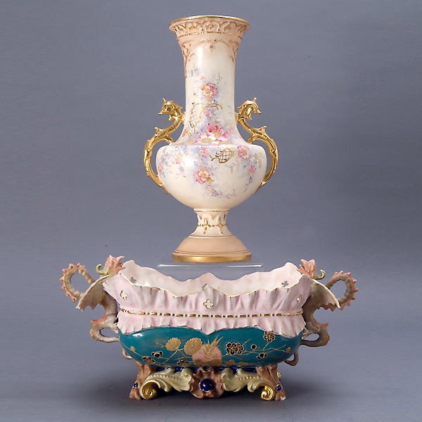 Two German Porcelains: a Royal Bonn urn: Two German Porcelains: a Royal Bonn urn and a centerpiece with dragon handles {Height of urn 14 inches} [Repairs and cracks]