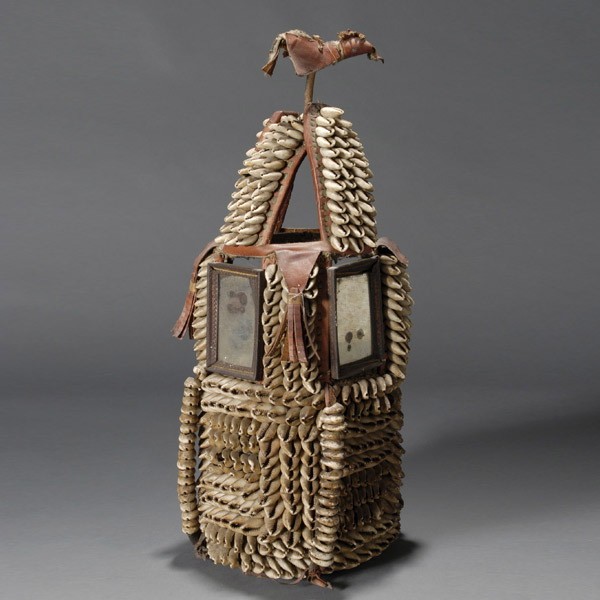 YORBA, house of the head covering.: YORUBA, house of the head covering. Leather with cowry shells and mirrors. H = 17 1/2 inches.