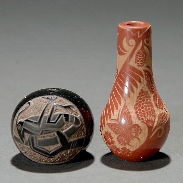 GRACE MEDICINE FLOWER CARVED VASE: Two carved miniture pueblo ceramic vases. GRACE MEDICINE FLOWER 1977 and unidentified artist, 1977. H = 2 inches