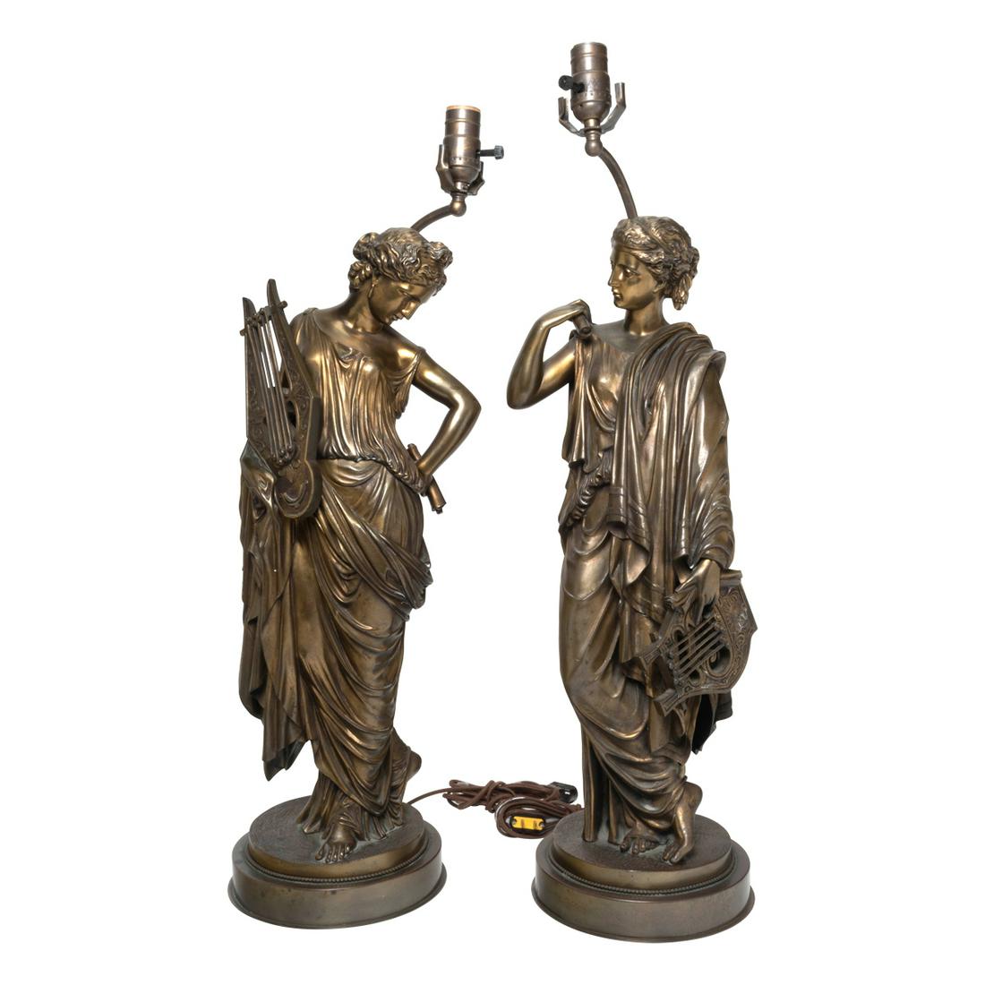 Pair of Gilt Bronze Figural Lamps, Muses.: Pair of Gilt Bronze Figural Lamps, Muses. Cast as standing classical maidens playing harps, now mounted as lamps, with black silk shades. {Approximate Dimensions: 23" H., figures from head tops to bas