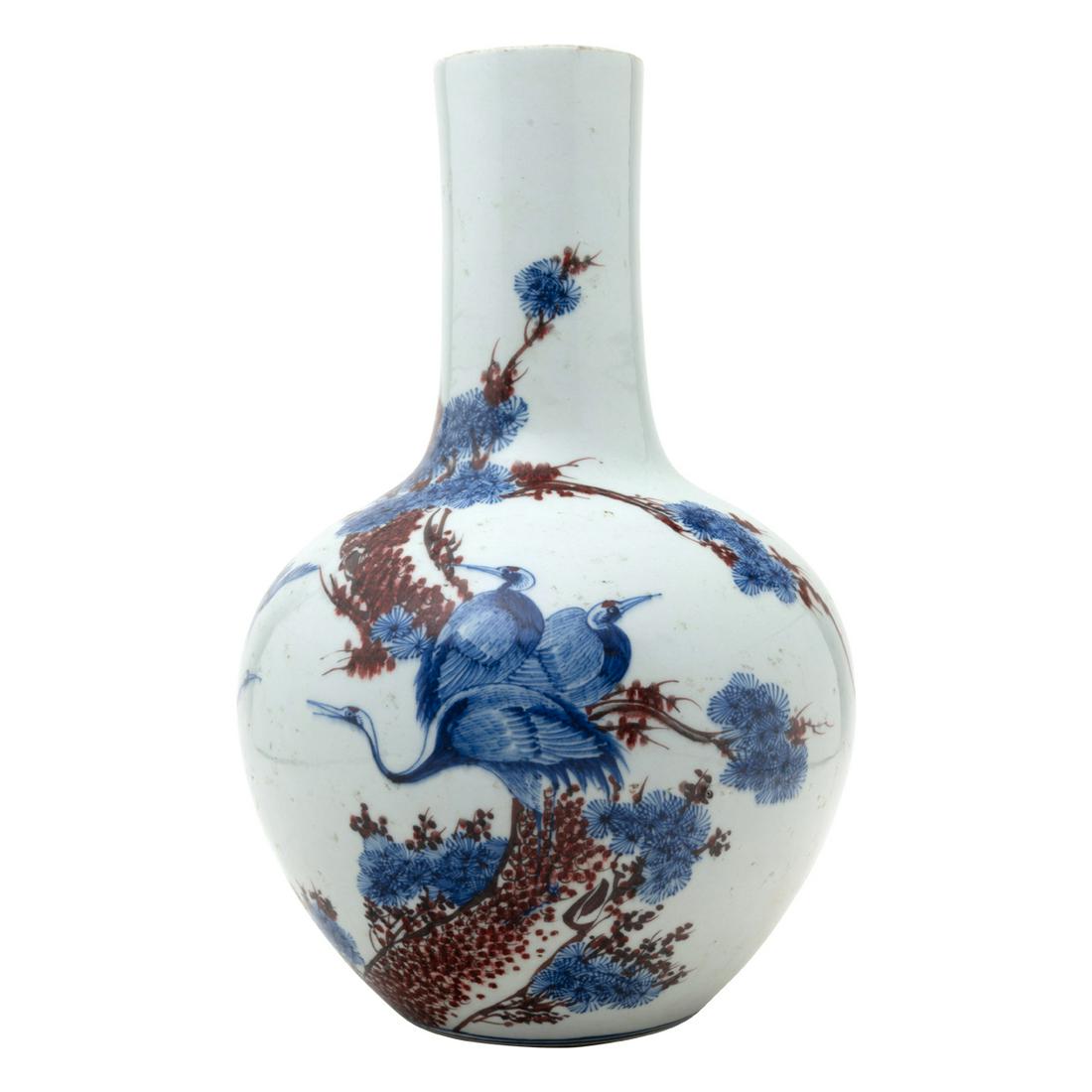 Chinese Red and Blue Crane and Pine Bottle Vase: Chinese Underglaze Red and Blue Crane and Pine Bottle Vase. Of globular body rising to a tall neck, the body decorated with cranes and a pine tree in unglazed red and blue, the bottom inscribed with a