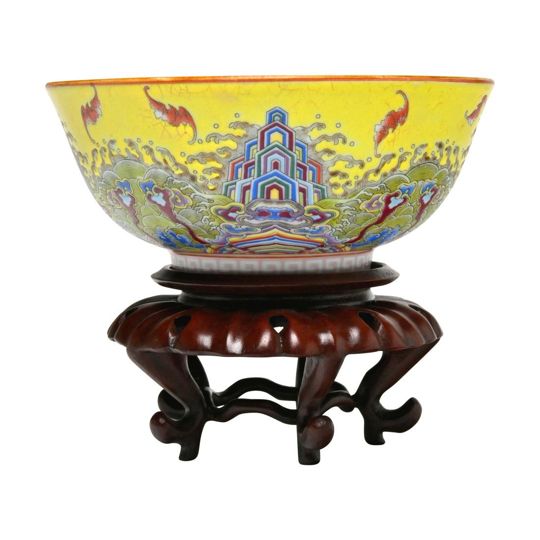 Chinese Yellow Ground Famille Rose Enamelled Bowl: Chinese Yellow Ground Famille Rose Enamelled Bowl with Base. The bowl on the short circular foot, the exterior decorated with the continuous scene depicting bats on the wave, the interior remains ligh
