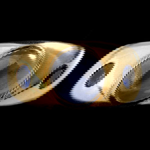 STAR SAPPHIRE, SAPPHIRE, 18K YELLOW GOLD RING: STAR SAPPHIRE, SAPPHIRE, 18K YELLOW GOLD RING. Centering one round star sapphire weighing approximately 5.00 cts., accented by two round-cut sapphire weighing a total of approximately 0.65 ct. Bezel a