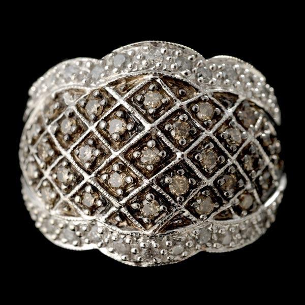DIAMOND, 10K WHITE GOLD RING: DIAMOND, 10K WHITE GOLD RING. Featuring thirty-one brown and twenty-six near colorless round-cut diamonds, weighing a total of approximately 0.50 ct, bead set in a 10k white gold mounting. 4.7 dwts. R