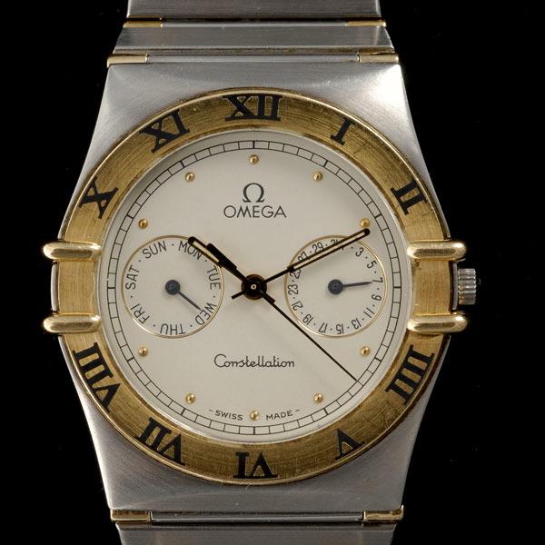 STAINLESS STEEL,YELLOW GOLD WRISTWATCH.: OMEGA CONSTELLATION STAINLESS STEEL, 14K YELLOW GOLD WRISTWATCH. Dial: round, off-white, applied gold dot hour markers, outer black minutes track, two subsidiary dials at 3 and 9 o'clock for day and d