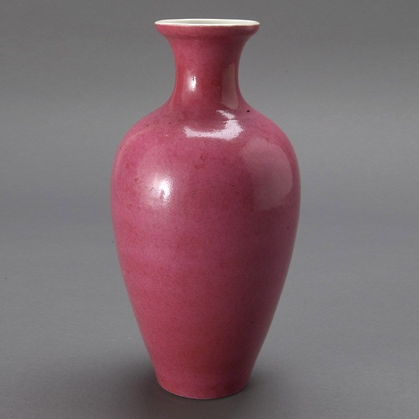 A Pink-Glazed Porcelain Vase: A Pink-Glazed Porcelain Vase, a mark to the base {Height 9 inches} [Small chips to base rim, firing frits]