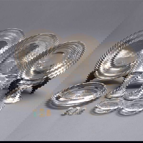 Sterling Group: 3 bowls; three collared coasters: Sterling Group: three bowls; three collared coasters; three weighted candlesticks; and three thimbles, one gold (12) {Total silver weight 11.27 troy oz; diameter of largest bowl 8 1/4 inches)