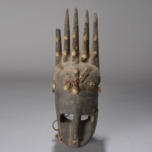 African mask ex emerson woelffer: BAMANA mask with resin, seeds, and shells. H = 16 inches. Provenance: the estate of Emerson Woelffer, Los Angeles.