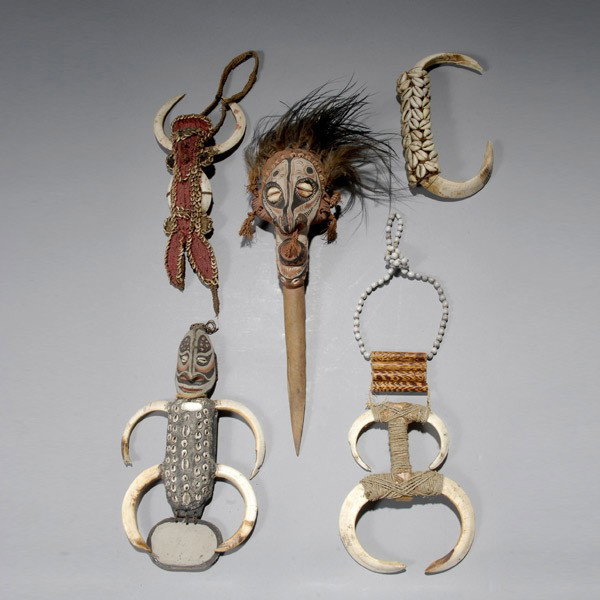 Five PAPUA NEW GUINEA items ex Emerson Woelffer: Five PAPUA NEW GUINEA items: Dagger/ chest ornaments. L = 14 inches with out feathers. Provenance: the estate of Emerson Woelffer, Los Angeles.