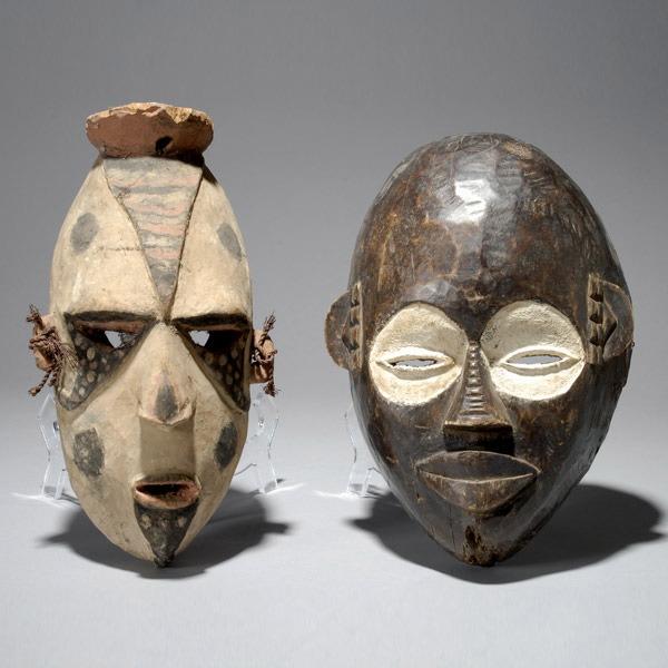 Two African masks ex Emerson Woelffer: TWO AFRICAN MASKS. H = 13 inches. Provenance: the estate of Emerson Woelffer, Los Angeles.