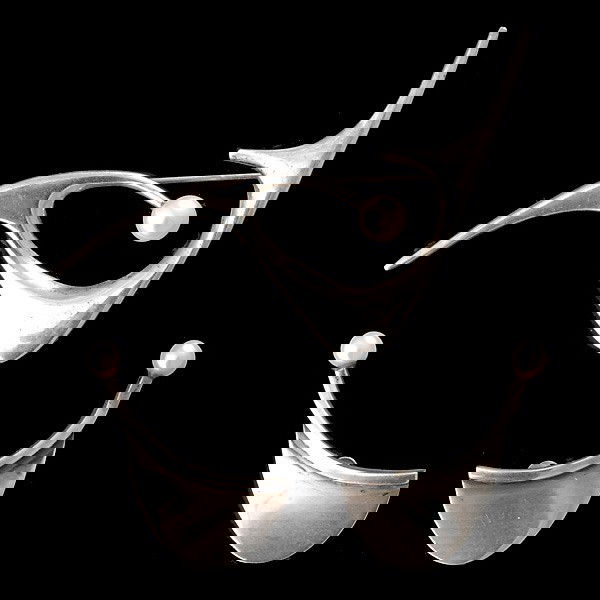 ED WIENER STERLING AND PEARL SUITE: ED WIENER STERLING AND PEARL SUITE Ed Wiener three piece sterling and pearl suite of pin and clip earrings. Ed Weiner (1918-1991) was inspired by unconventional forms. His jewelry was highly artistic,