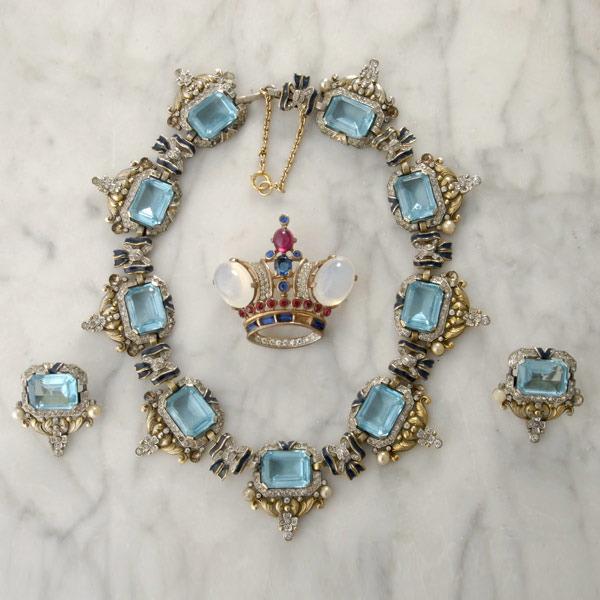 COLLECTION OF TRIFARI JEWELRY: COLLECTION OF TRIFARI JEWELRY. Including a necklace set with nine emerald-cut greenish blue paste, accented by approximately four hundred fifteen colorless paste, and eight pearl like beads. Further d