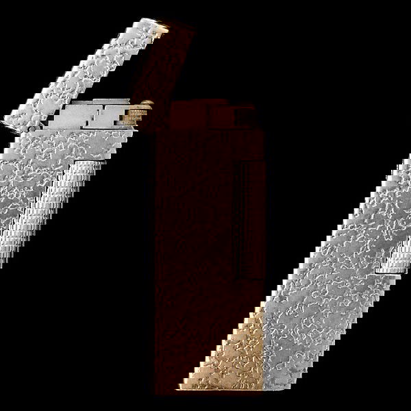 DUNHILL 14K YELLOW GOLD LIGHTER: DUNHILL 14K YELLOW GOLD LIGHTER. The textured lighter is signed 14k gold outer jacket, Dunhill, and measures two inches long by seven-eighths wide by a half inch deep.