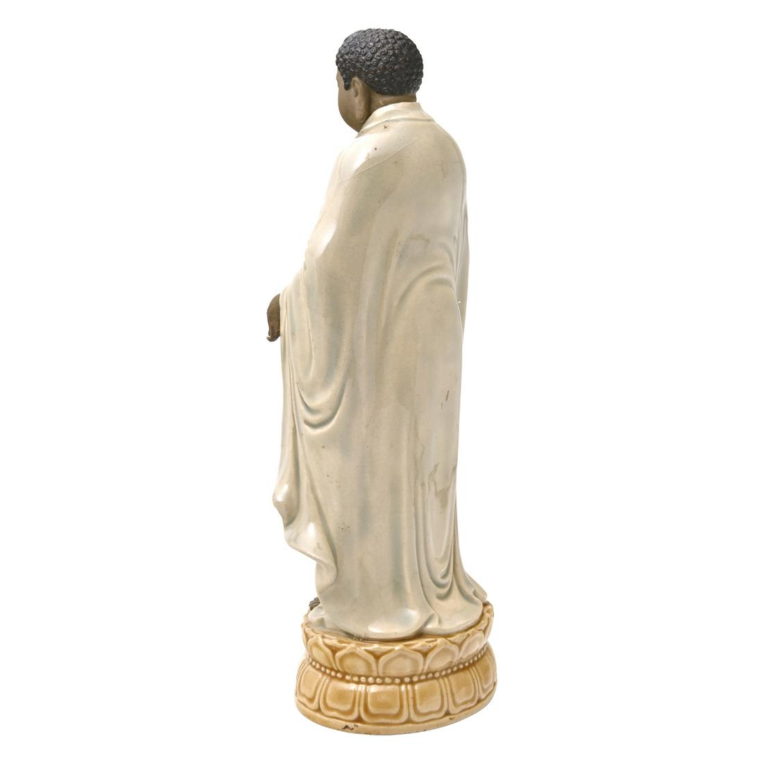 A Chinese Shiwan Pottery Figure of a Buddha (1 of 2)