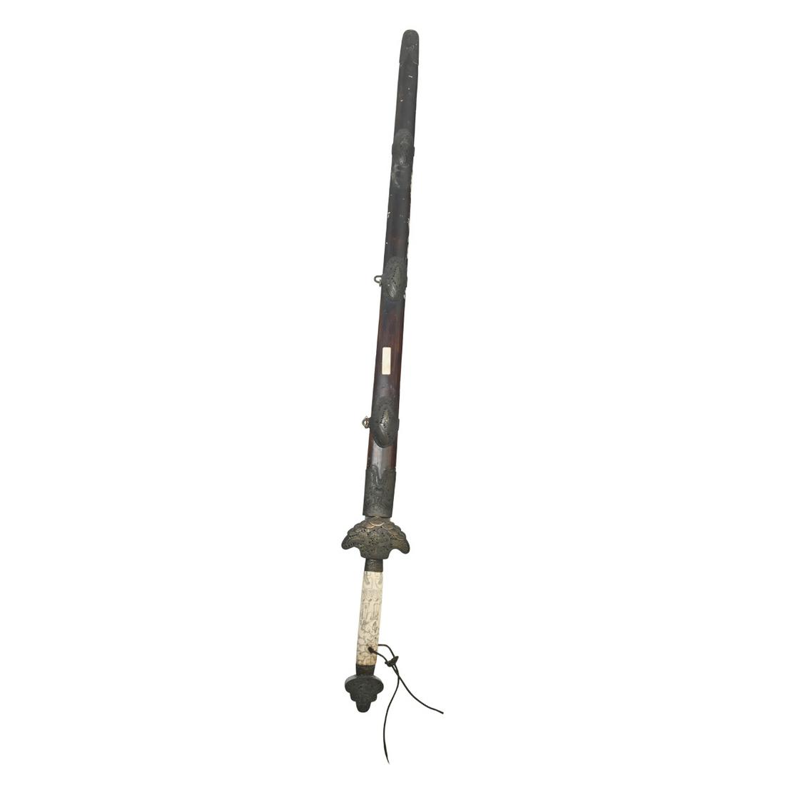 A Chinese Long Sword with Brass Mounted scabbard: A Chinese Long Sword with Brass Mounted scabbard. The Chinese sword with metal mounted wooden scabbard and bone handle, blade with incised, inlaid and gilt figural motif. {Length: 45 1/2 inches (115 c