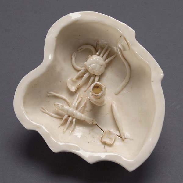 A Dehua Brush Washer, Qing Dynasty: A Dehua Brush Washer, Of steeply sided leaf form decorated with small applied crab and shrimp figures to the interior, a delicate branch encircles the central cylinder rising from floor. Qing Dynasty,
