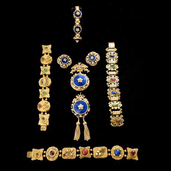COLLECTION OF SEVEN COSTUME JEWELRY ITEMS.: COLLECTION OF SEVEN COSTUME JEWELRY ITEMS. Including a four piece "Florenza" blue enamel suite and three "Art" multi-stone link bracelets.