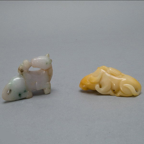 Two Small Jade Animal Models: Two Small Jade Animal Models, the first a yellow jade buffalo surmounted by a turtle; the second a monkey riding a horse with dark green inclusions {Length 3 inches} [Small chips]