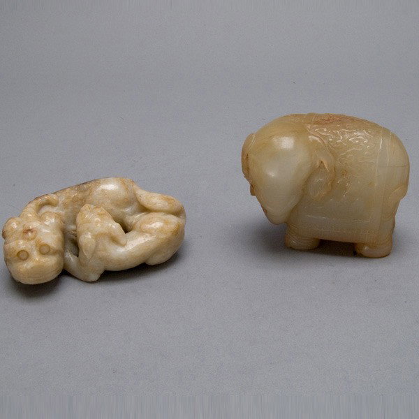 Two Jade and Hardstone Animal Models: Two Jade and Hardstone Animal Models, the first an elephant draped with a blanket carved with swirling clouds and bats; the second a Ming style recumbent unicorn group; each with a fitted box {Height 