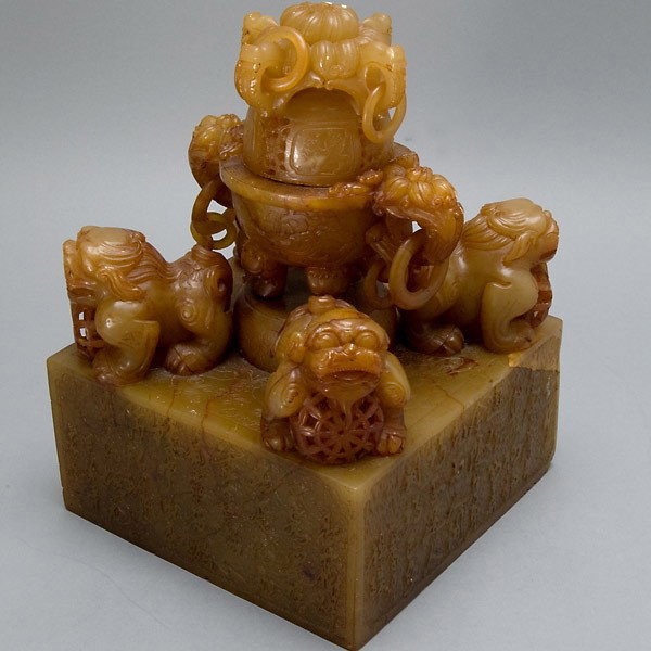 A Large Soapstone Seal Topped w/ a Censer & 4 Lion: A Large Soapstone Seal Topped with a Censer and Four Lions, of square section elaborately incised to the sides and top with inscriptions and dragons, each corner with a standing lion guarding a reticu