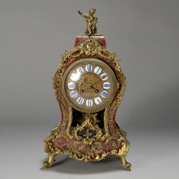 French Boullework Gilt Bronze Cartel Clock: French Boullework Gilt Bronze Tortoise Shell Cartel Clock The four sided waisted case decorated with a scrolling foliate engraved brass inlay mounted on a green tortoise shell ground, centered by a gi