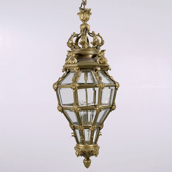Louis XV Style Gilt Bronze Crystal Lantern: Louis XV Style Gilt Bronze Crystal Lantern The crown form encadrement ceiling cap supporting the cage form frame, with corner leafy rosettes inset with four horizontal rows of square and trapezoidal s