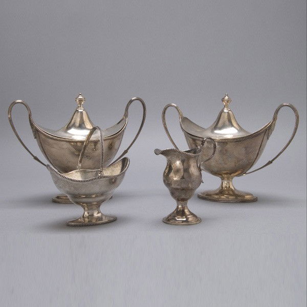Hester Bateman Pr Silver Tureens: Pair of English Sterling Covered Pedestal Tureens Each of helmet form with a pedestal foot and twin fluted handles, the cover cast with an urn form finial, both base and cover with engraved deer on ba