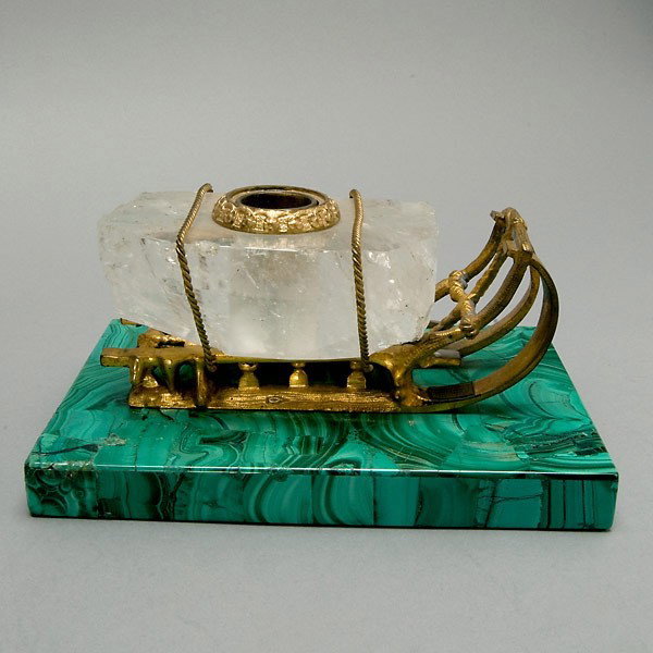 Russian Gilt Bronze, Malachite Rock Crystal Inkwe: Russian Gilt Bronze, Malachite and Rock Crystal Inkwell A model of a sled pulling a rock crystal specimen simulating a block of ice, fitted with an inkpot, applied to a malachite specimen base. Early 