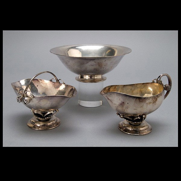 Georg Jensen Sterling Group: Georg Jensen Sterling Group Comprising: a matching creamer and sugar, each of helmet shape raised on a cushioned open work base with stems allover a stepped base; together with an associated footed bo