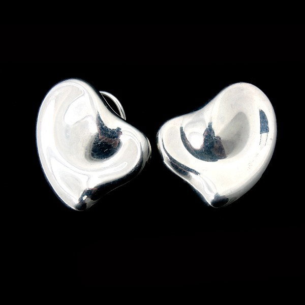 TIFFANY & CO, ELSA PERETTI S/S FULL HEART EARRINGS.: PAIR OF TIFFANY & CO., ELSA PERETTI STERLING SILVER FULL HEART EARRINGS. Each designed as a heart motif in sterling silver completed by a post and omega back. 8.5 dwts